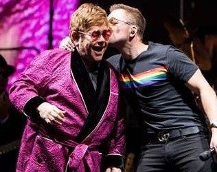 Watch: Surprise Duet From Elton John & Rocketman’s Taron Egerton On Stage At Elton’s Farewell Tour In UK